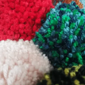 Close-up of colorful textured yarn fabric.