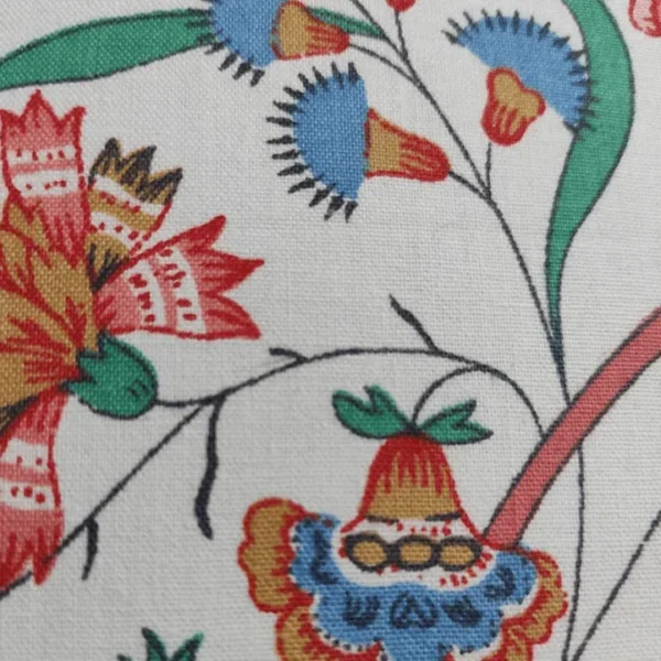 Floral fabric with colourful embroidered pattern and gnome design.