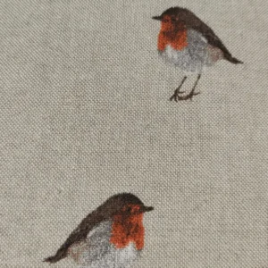 Embroidered robins on linen fabric