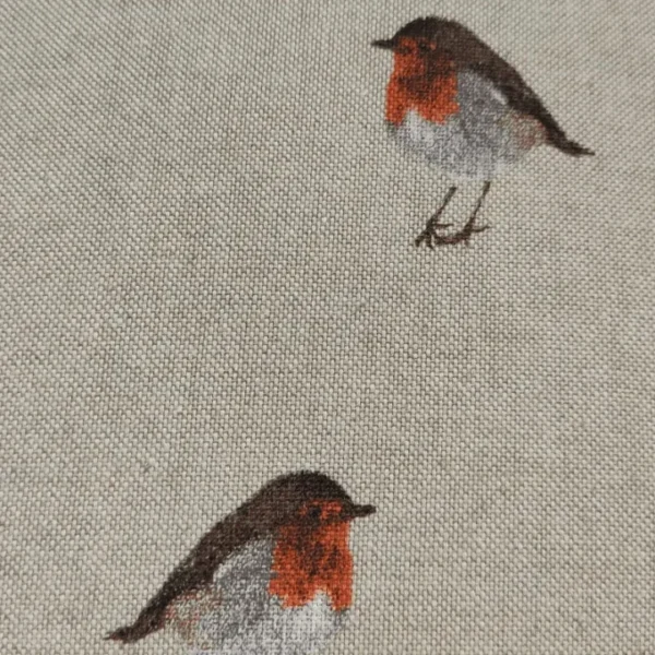 Embroidered robins on linen fabric