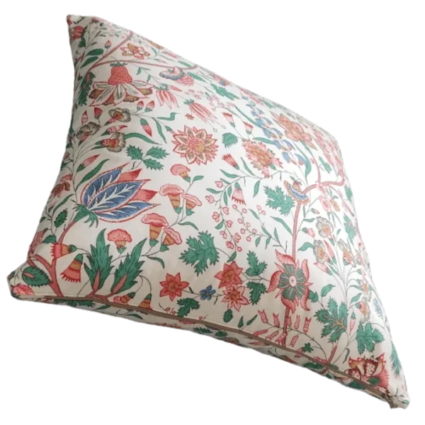 Floral patterned cushion on white background.