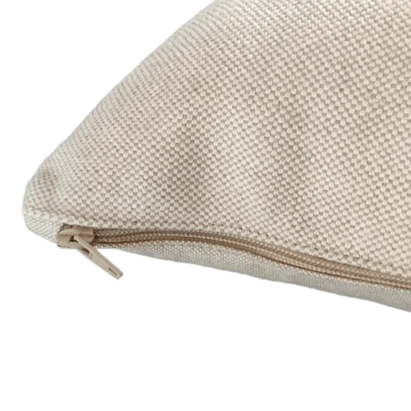 Close-up of beige textured cushion with zipper.
