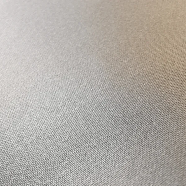 Close-up of textured grey fabric surface.