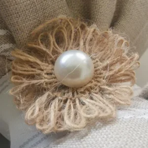 Handmade jute twine flower with pearl centerpiece.